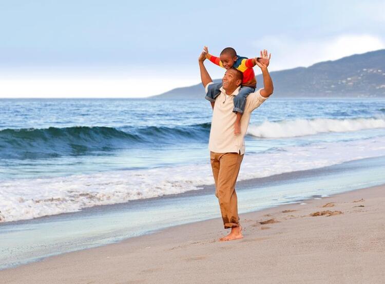 Man and son on beach